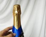 Decoration of bottles for the new year with ribbons Champagne Santa Claus