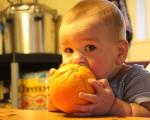 When can you give an orange to a child and in what quantity?